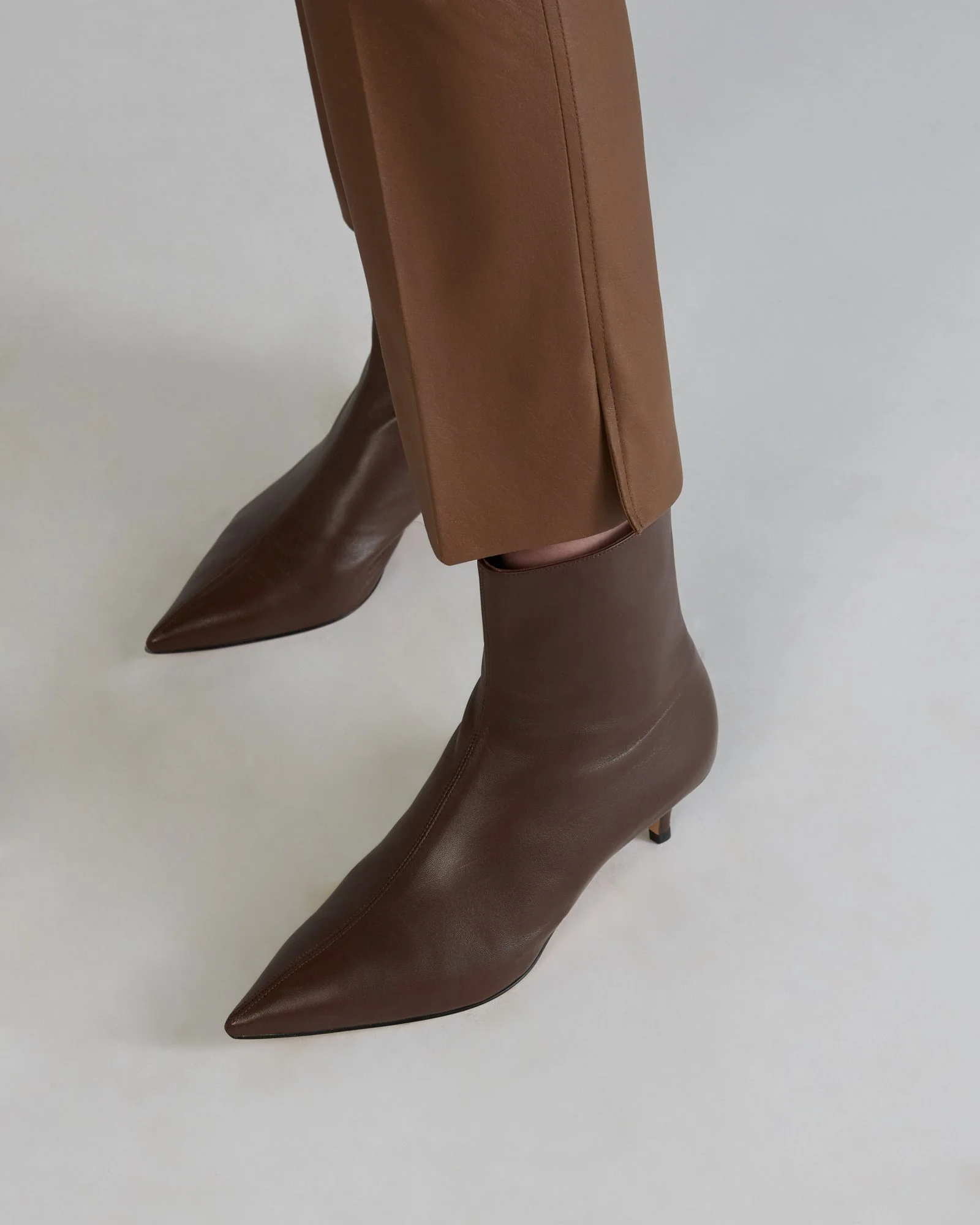 Slim fit trousers in stretch faux leather - Image 4
